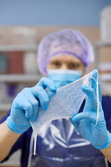 Fototapeta premium A laboratory worker checks the condition of the samples before testing