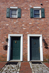 Fototapeta na wymiar Two Doors Side-by-Side in an Historic Brick Building