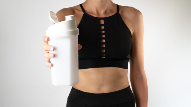 Woman with shaker in hand - sports