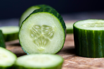 Sliced green cucumber while cooking salad
