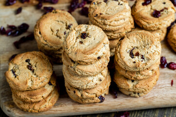 delicious dried cookies made of high-quality flour with dried red cranberries on the table