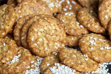 oatmeal thin round cookies with lots of sesame seeds