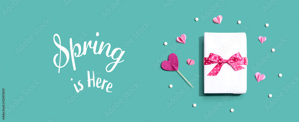 Wall mural spring is here message with a gift box and paper hearts - Wall murals