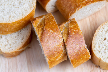 sliced into pieces a long baguette with a crispy crust