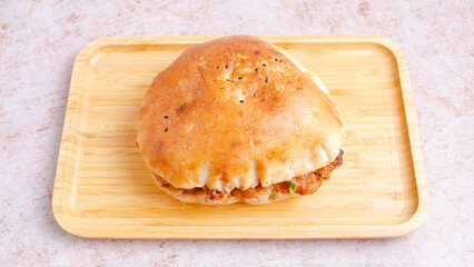 Chicken shawarma on wooden tray top view isolated