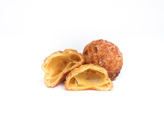 half cut choux pastry on white background