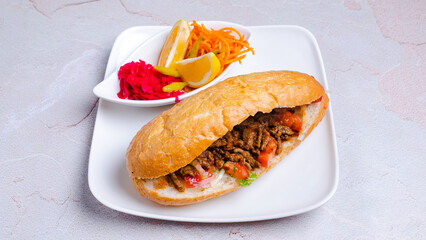 Beef doner kebab and vegetables in plate top view isolated