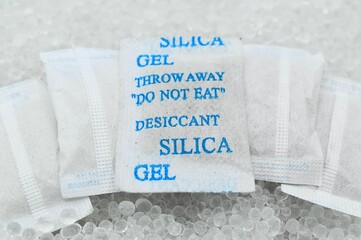 Sachet of new silica gel crystals. It is a desiccant. It adsorbs water vapor.