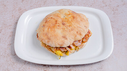 Chicken tombik doner kebab in plate top view isolated