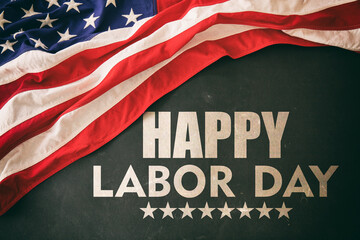 Fototapeta na wymiar Happy Labor Day and USA Flag on black. Holiday celebration background, overhead