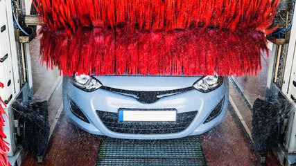 Car wash automatic carwash. Brush washer clean blue auto car on automatic car wash station. Auto...
