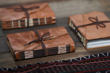 Vintage Dark Brown Leather Notebook Journal on Wooden Table