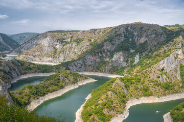 Obraz na płótnie Canvas Meanders at rocky river Uvac gorge on sunny day, southwest Serbia.