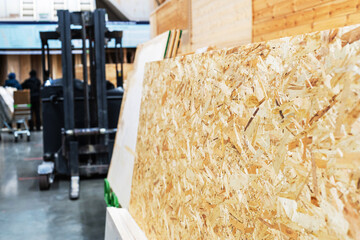 OSB sheets on the counter in a hardware store. Trade in materials from chips and glue. Panels for...
