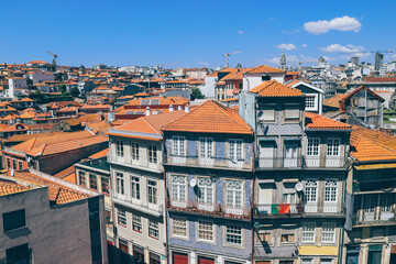 Density of buildings in Porto city with very orange roofs on summer day 