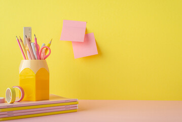 School supplies concept. Photo of trendy stationery on pink table stand for pens stack of copybooks...