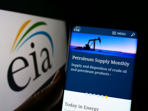 Stuttgart, Germany - 07-30-2022: Person holding cellphone with website of US Energy Information Administration (EIA) on screen in front of logo. Focus on center of phone display.