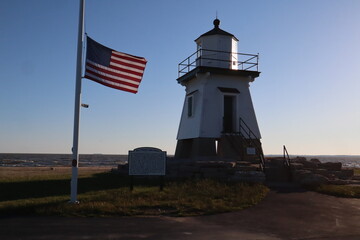 Port Clinton lighthouse and American flag