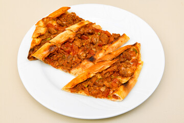 Pide, karisik pide, mixed pita. Turkish pide with sucuk sausage, meat and cheese. Turkish pizza. mixed pita. Pide on white background. 