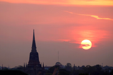 Fototapeta na wymiar Silhouette Buddhism pagoda on dramatic sky background during sunset