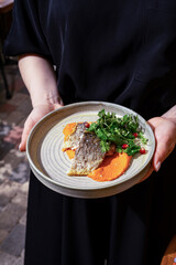 pike perch from sea fish, beautiful restaurant serving, decorated with greenery