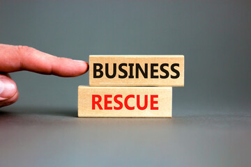 Business rescue symbol. Concept words Business rescue on wooden blocks on a beautiful grey table...