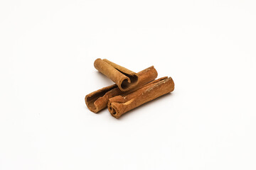 Cinnamon sticks on a white background. Close-up