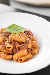 Bolognese pasta with grated parmigiano 