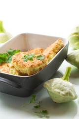 vegetable fried squash and zucchini cutlets in a ceramic form