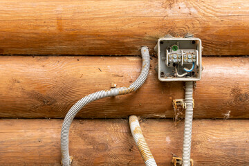 junction box with twisted and soldered electrical wires on wall house