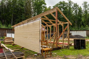 construction of a frame house. Timber frame house, new build roof 