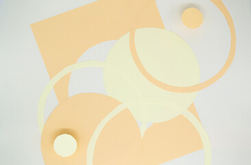 Abstract background with 3D paper elements in beige, orange colors resembles female forms - chest,...