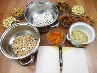     Traditional Turkish Noah's pudding in bowl on wooden table. Copy space        