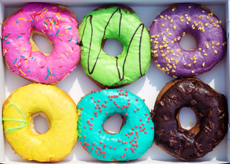 Donuts in cardboard packaging. Doughnuts set with sprinkles in paper box. Sweet snack, dessert, friedcake, pastry, yummy, coffee break
