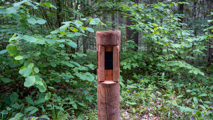 The tourist counter located in the forest on the tourist trail, which counts the visitors of the nature park - pedestrians and cyclists