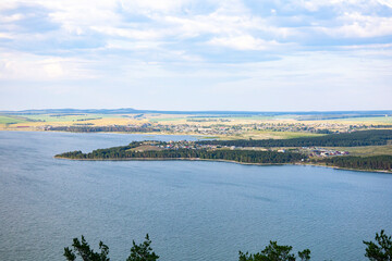 The landscape of the lake, and a distant view of the shore.