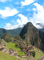 Fototapeta premium Machu Picchu, ancient Inca city, one of the most precious treasures of Peru. Means old mountain, a tourist destination considered one of the seven new wonders of the modern world and a world heritage 