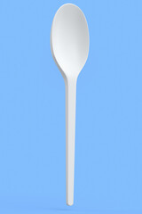 Eco-friendly disposable utensils like spoon on blue background.