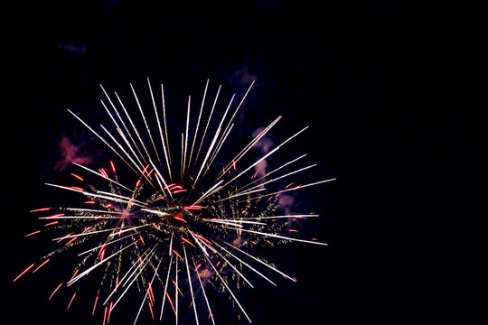 Colorful fireworks in the night sky. Festive pyrotechnics. Background image.
