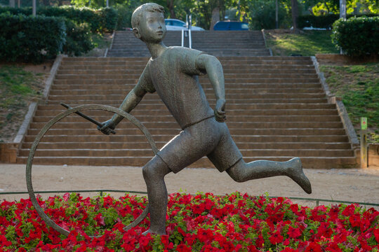 Sculpture el nen de la rutlla or child of the hoop in Horta Guinardo Barcelona