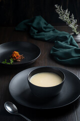 Yakhni Shorba soup served in a bowl isolated on dark background side view food