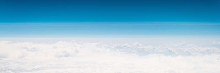 beautiful blue sky with white clouds heaven horizon over planet earth world, view from the airplane or satellite. atmosphere or stratosphere space layer. astronomy and geology sciense nature. banner