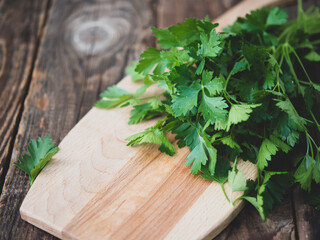 Fresh italian parsley on a wooden table. parsley.