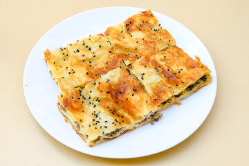 Homemade burek (borek)  with cheese and spinach and boiled egg.Traditional food. Peynirli,...