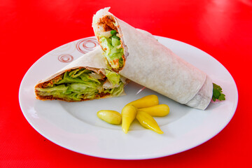 Lavash doner kebab ( zurna doner durum )  or shawarma sliced in plate isolated. 
