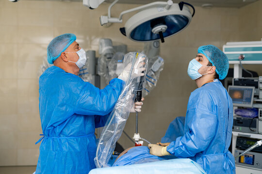 Surgery Specialists Working With Modern Equipment. Teamwork Professional Emergency.