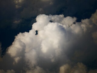 Fototapeta premium Medium close up of thick fluffy, white clouds in the skies