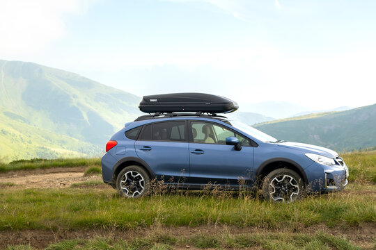 Blue Subaru Crosstrek off road car on mountain trail. Traveling by auto, adventure in wildlife, expedition or extreme travel on SUV automobile. Karpaty, Ukraine - July 7, 2021.