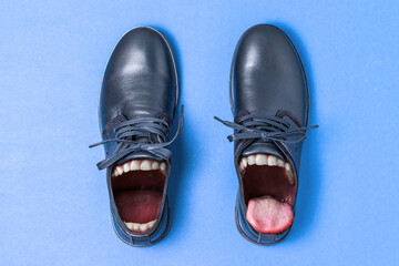 Shoe with the mouth. Toothy shoes with tongue. Concept of communication or talks. Uncomfortable shoes that can chafe. Creative conceptual collage. - obrazy, fototapety, plakaty