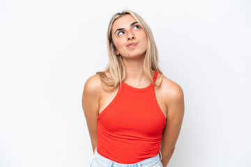 Young caucasian woman isolated on white background and looking up